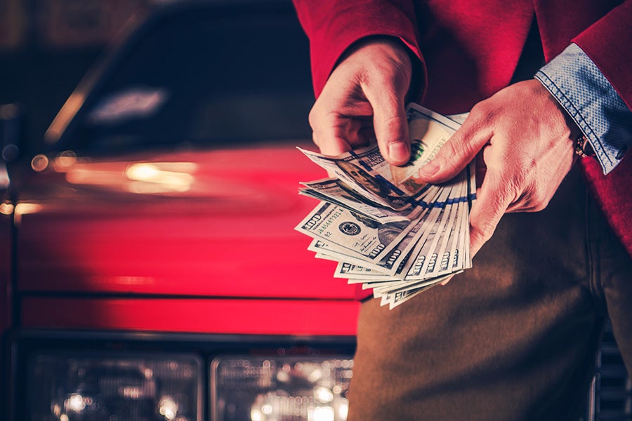 A person holding cash